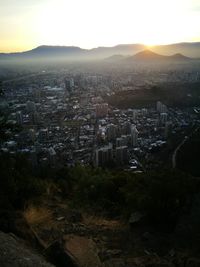 High angle view of townscape against sky at sunset