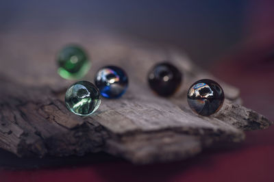 Close-up of multi colored glass on table