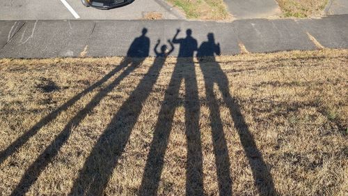 High angle view of people shadow on road