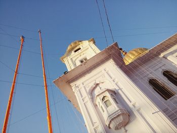 Low angle view of buildings against blue sky