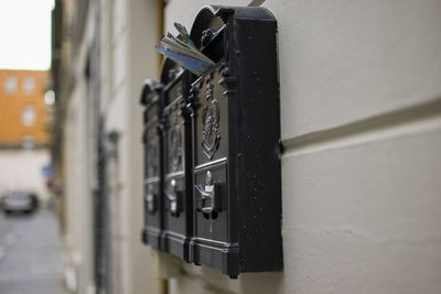 Close-up of telephone booth on wall
