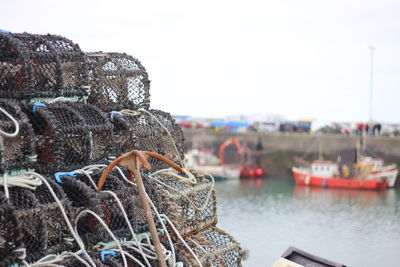 Close-up of fishing net on sea against clear sky