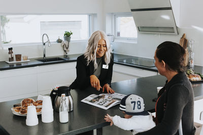 Estate agent showing woman house