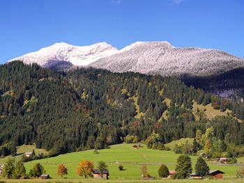 Scenic view of snowcapped mountains against clear sky