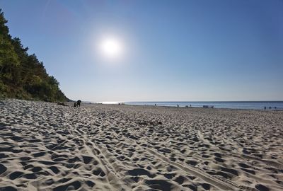 Scenic view of beach against clear sky