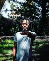 Man statue against trees