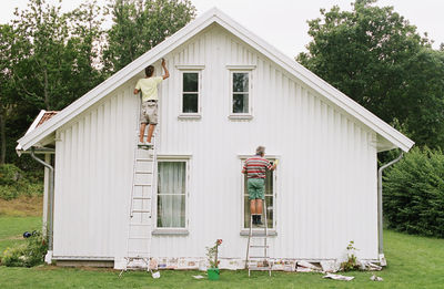 Men painting house