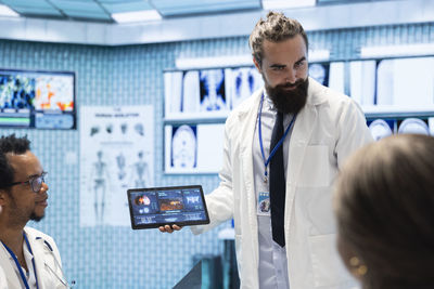 Side view of doctor working in office