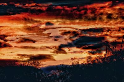 Scenic view of dramatic sky during sunset