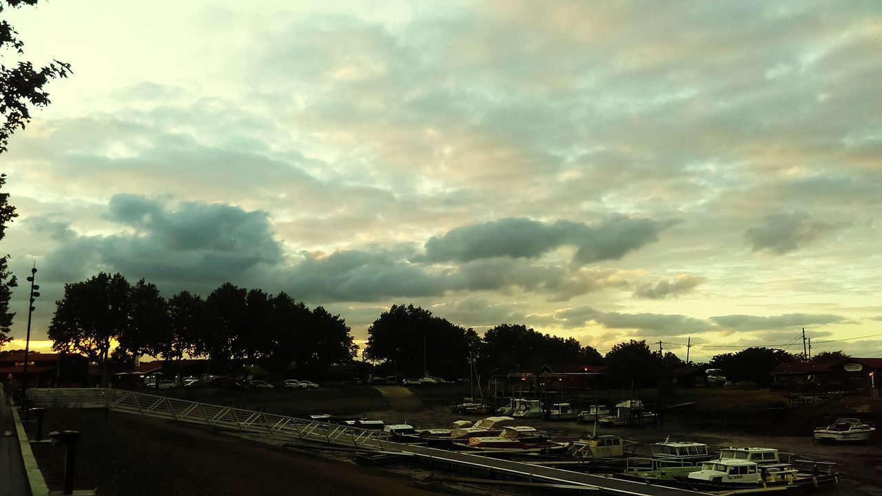 CAR ON ROAD AGAINST SKY