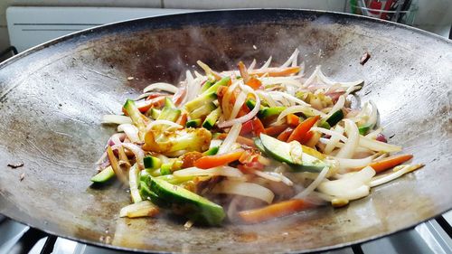 Close-up of fresh vegetables in cooking pan