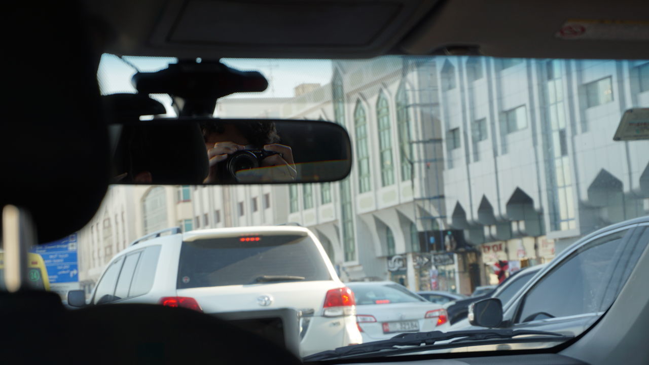 REFLECTION OF MAN IN BUS