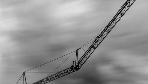 Low angle view of cables against sky