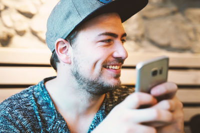 Portrait of young man using mobile phone