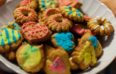 High angle view of colorful homemade biscuits in plate