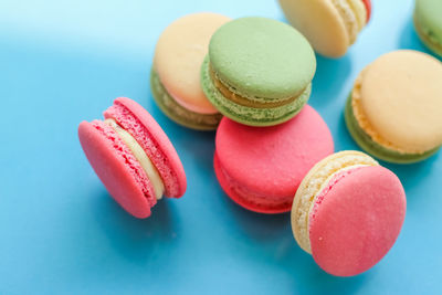Close-up of macaroons against blue background