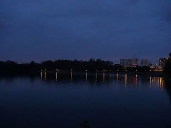 Reflection of illuminated buildings in water