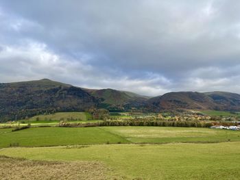 Scenic view of landscape and mountains against sky