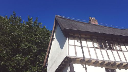 Low angle view of built structure against blue sky