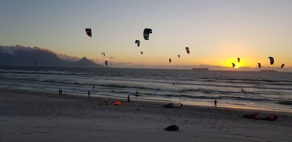 Scenic view of beach against sky during sunset