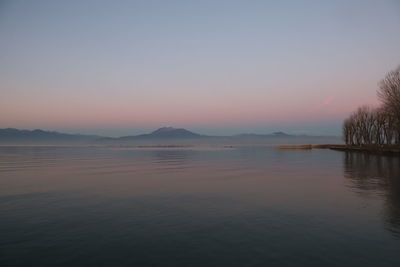 Scenic view of lake against sky during sunset