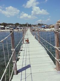 Pier over sea against sky