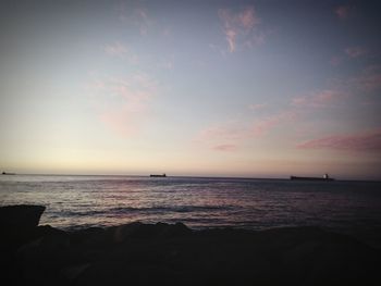 Scenic view of sea against sky at sunset