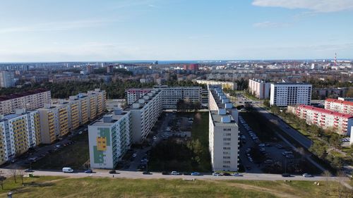 High angle view of buildings in city against sky