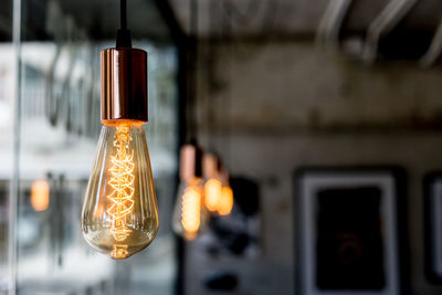 Close-up of illuminated light bulb