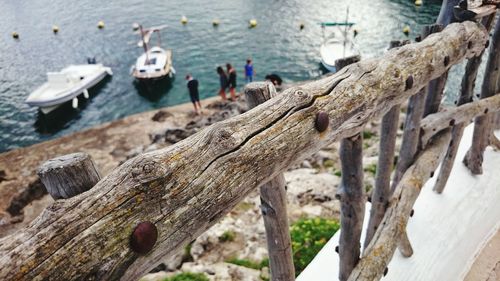 Wooden railing against lake