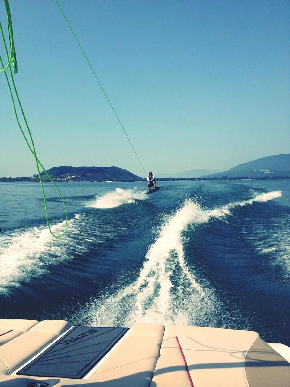 water, sea, clear sky, horizon over water, nautical vessel, transportation, wave, blue, leisure activity, lifestyles, surf, men, vacations, mode of transport, scenics, sailing, copy space, nature