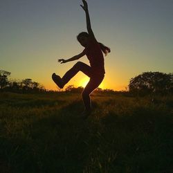 Woman jumping on field