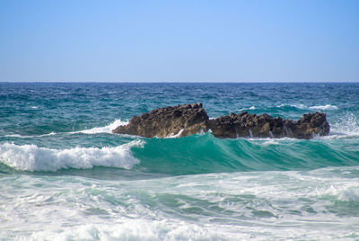 Scenic view of sea against clear sky