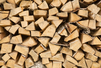 Full frame shot of wooden logs in forest