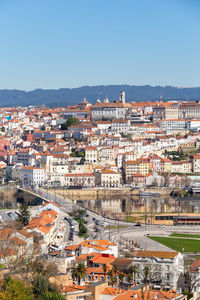 High angle view of townscape against blue sky