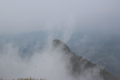 Scenic view of waterfall against sky