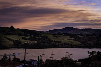 Scenic view of mountains against sky at sunset