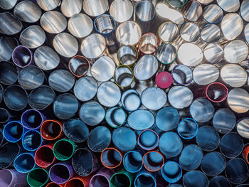 Full frame shot of stack of pipes