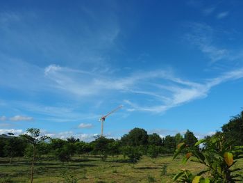 Scenic view of landscape against blue sky