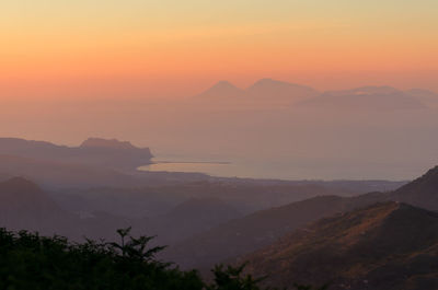 Scenic view of mountains against sky during sunset