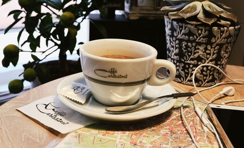 Close-up of coffee cup on table