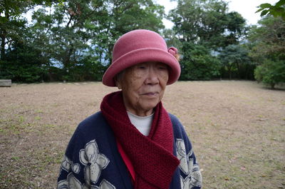 Senior woman standing on field