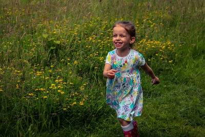 Cute girl smiling while walking on land