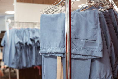 Close-up of medecine clothes hanging on rack
