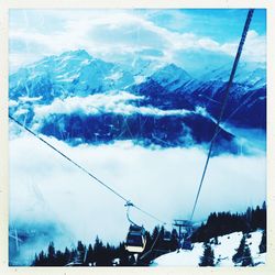 Scenic view of snow covered mountains against sky