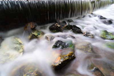 Close-up of stream flowing through rocks