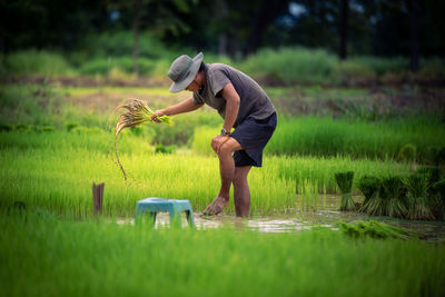 Full length of man standing on field