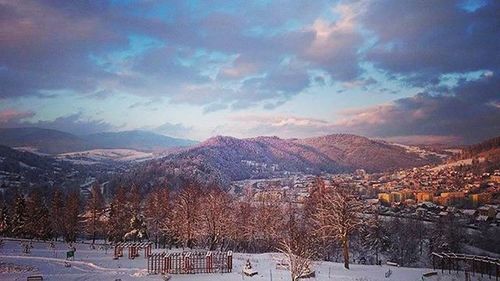 Scenic view of snow covered mountains against sky