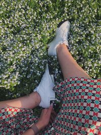 Low section of woman wearing shoes outdoors