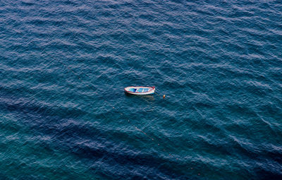 Aerial view of boat floating on sea